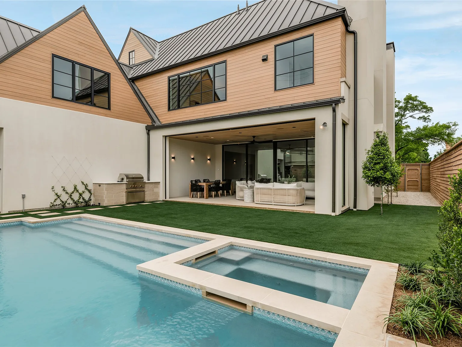 Resort-style infinity pool at a Kingdom Development custom estate